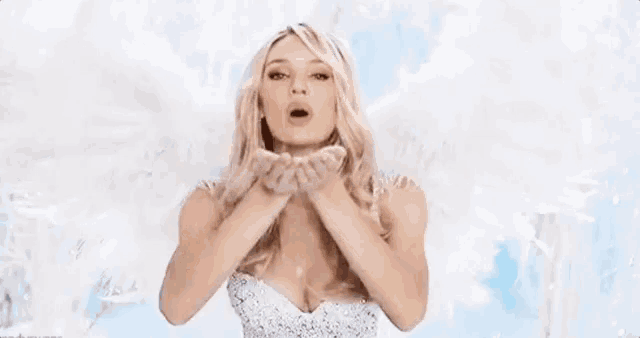 a woman blowing a kiss with the words dorme com deus in the background .