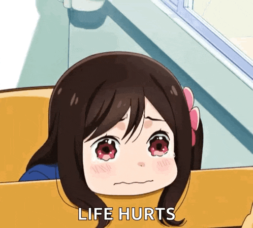 a little girl is crying with the words " life hurts " above her