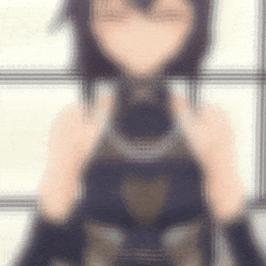 a blurry picture of a girl with dark hair and black gloves