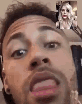a man is making a funny face while talking to a woman .