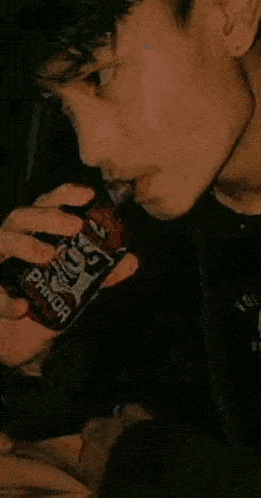 a close up of a person eating a pineapple slice