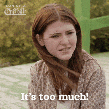 a woman says it 's too much in front of a green sign