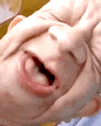 a close up of a person 's face with their mouth open and their eyes closed .