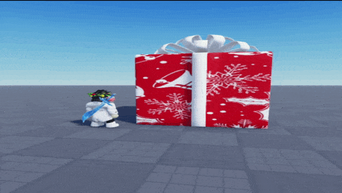 a snowman standing next to a large red gift box with snowflakes on it