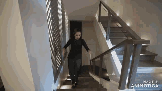 a woman is walking down a set of stairs made by animatica