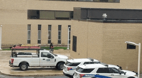a belmont sign is on the side of a building next to a truck