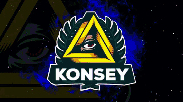 a green triangle with an all seeing eye and the word konsey below it