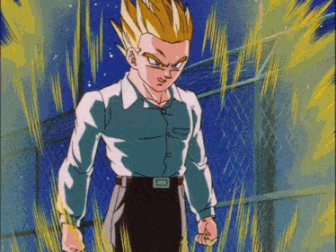 a man in a blue shirt and black pants stands in front of a chain link fence