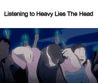 a group of people are listening to heavy lies the head while holding light bulbs