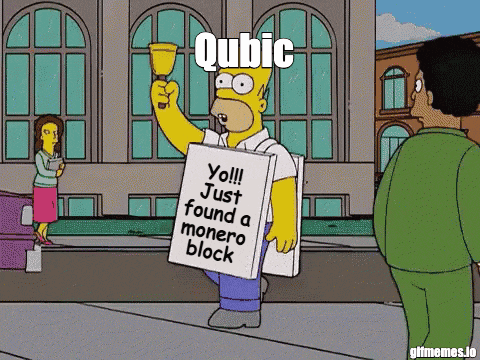 homer simpson from the simpsons holding a sign that says qubic