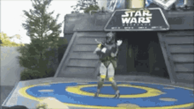 a person in a star wars costume is standing on a stage