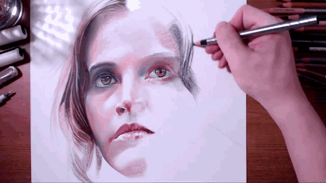 a person is drawing a woman 's face with a pencil