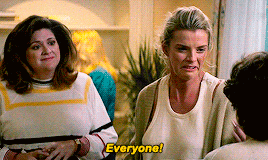 two women are talking to each other and one of them is saying everyone .
