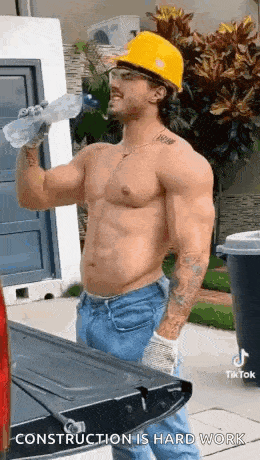 a shirtless construction worker is drinking water from a bottle while wearing a hard hat and safety glasses .