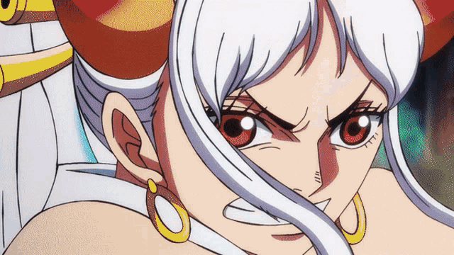 a close up of a cartoon character with red eyes