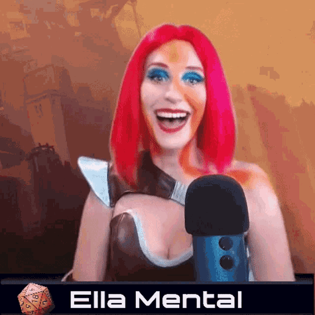 a woman with red hair is smiling and holding a microphone with the name ella mental written below her