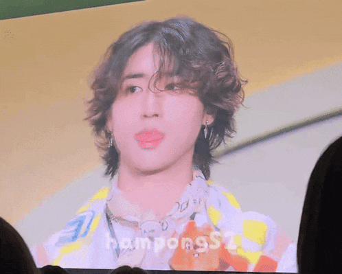 a picture of a young man with curly hair is being displayed on a screen with the name rampongss2 on the bottom