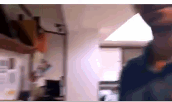 a blurry picture of a person 's face in a room