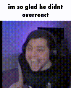 a man wearing headphones is smiling with the caption im so glad he didnt overreact .