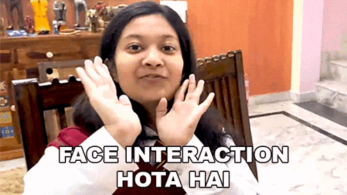 a woman sitting in a chair with the words face interaction hota hai written on the bottom