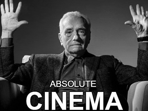 a black and white photo of a man with his hands in the air and the words absolute cinema above him