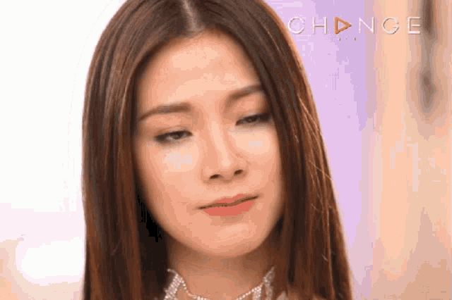 a close up of a woman 's face with the word change on the bottom right