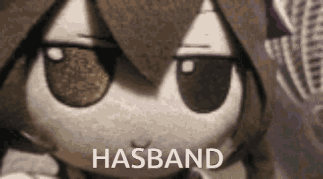 a close up of a stuffed animal with the word husband written on it