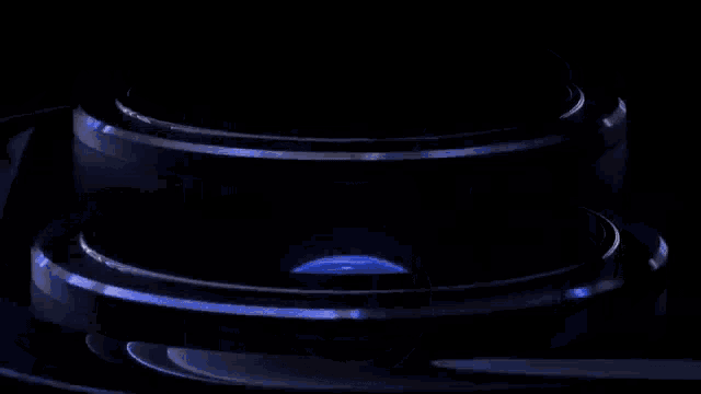 a close up of the camera lens of a cell phone against a black background .