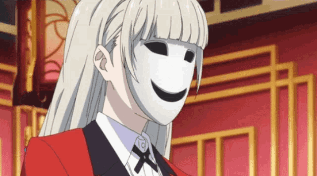 a girl wearing a white mask with a black smile on her face