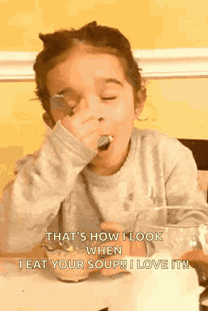 a little girl eating soup with a caption that says that 's how i look when i eat your soup !