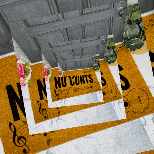a door mat that says " no cunts " is on the floor