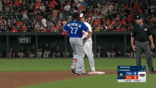 a baseball player wearing a blue jersey with guerrero jr 27 on it