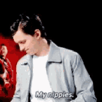 a man in a gray jacket is saying my nipples
