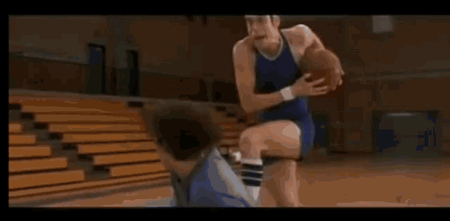 a basketball is going through a hoop on a court