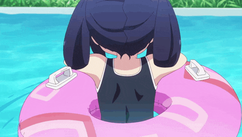 a girl in a swimsuit is sitting in a pink float in a swimming pool