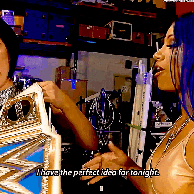 a woman with blue hair says i have the perfect idea for tonight while holding a trophy