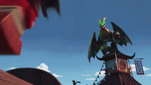 a dragon is on top of a building with a sign that says ninja