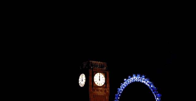 fireworks are displayed in front of the big ben clock tower in london