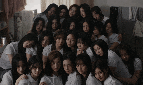 a group of young women are posing for a photo