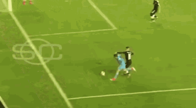a soccer game is being played on a field with a red sign that says ' a. i. ' on it