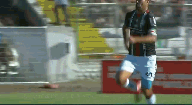 a soccer player with the number 60 on his shorts is running
