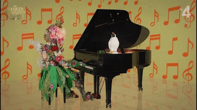 an advertisement for the masked singer features a piano