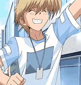 a boy in a blue and white shirt with a name tag on his neck