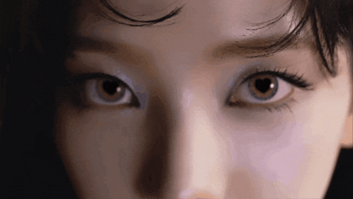 a close up of a woman 's eyes with makeup