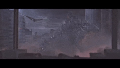 a monster is flying through the air in a dark city