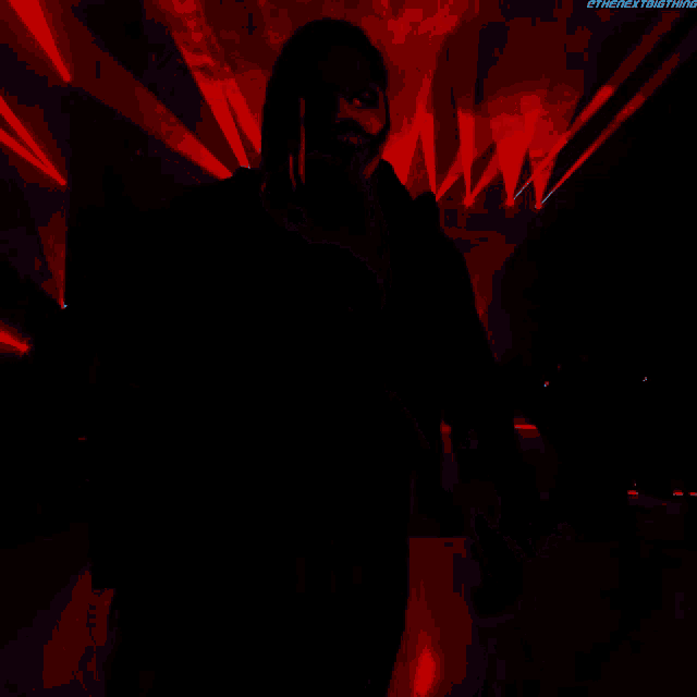a person with dreadlocks and a blue face is standing in front of a red background that says thenextbigthing