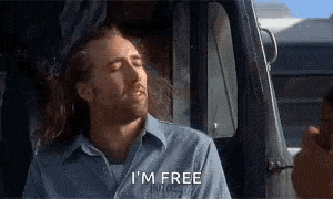 a man in a blue shirt says i 'm free while sitting in a car
