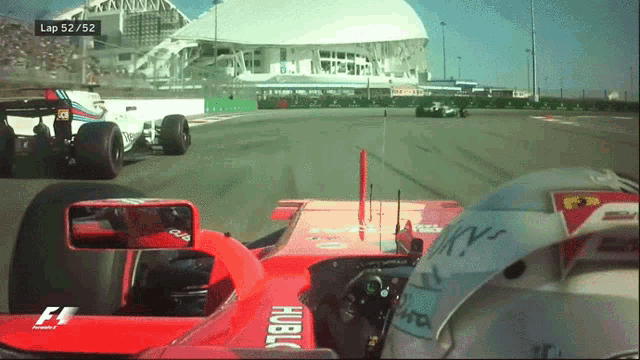 a race car is on a track and the lap is 52/52