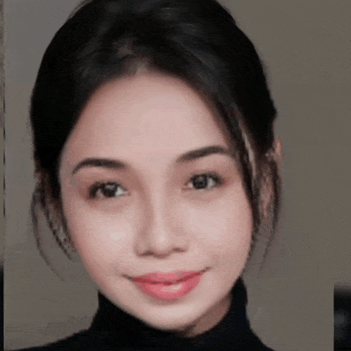a close up of a woman 's face with a turtleneck on