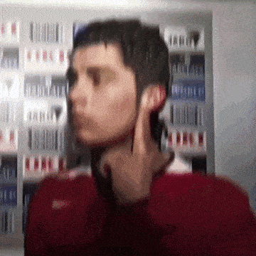 a blurry picture of a man talking on a phone